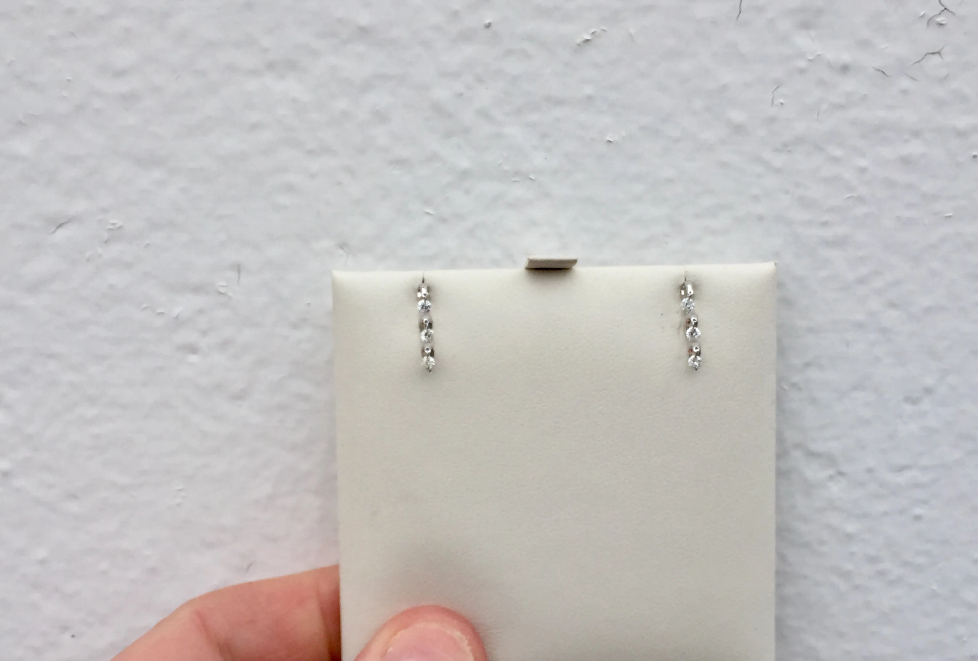 14 K White Gold Dangle Diamond Earrings 0.27 Carats.